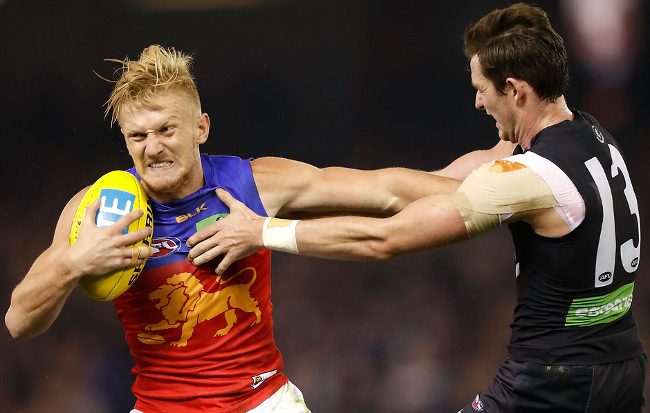 Photographers Choice - AFL 2016 Rd 11 MELBOURNE, AUSTRALIA - JUNE 04: Nick Robertson of the Lions fends of Jed Lamb of the Blues during the 2016 AFL Round 11 match between the Carlton Blues and the Brisbane Lions at Etihad Stadium on June 4, 2016 in Melbourne, Australia. (Photo by Michael Willson/AFL Media)